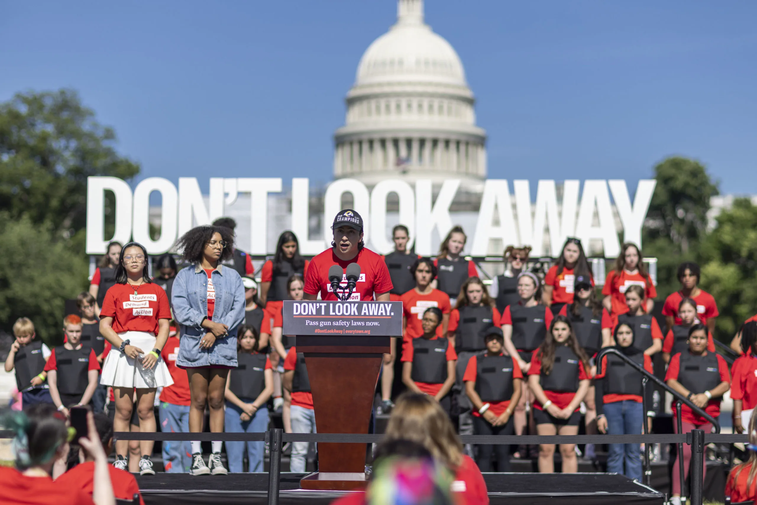 Emmanuel “Manny” Macedo speaking at the Don’t Look Away rally in front of other Students Demand Action volunteers at the U.S. Capitol