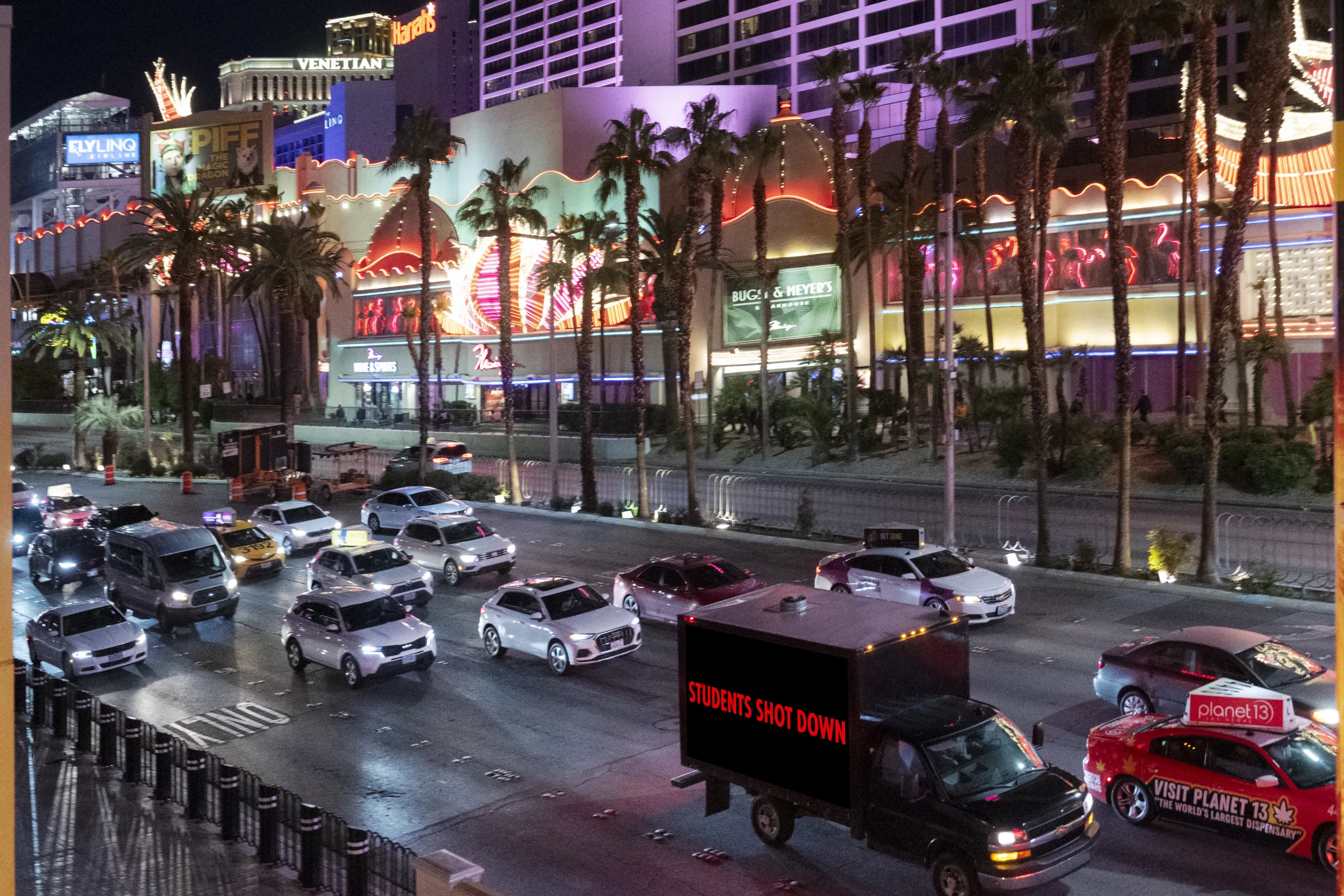 Bird's eye view of truck in Las Vegas that says “Students shot down”