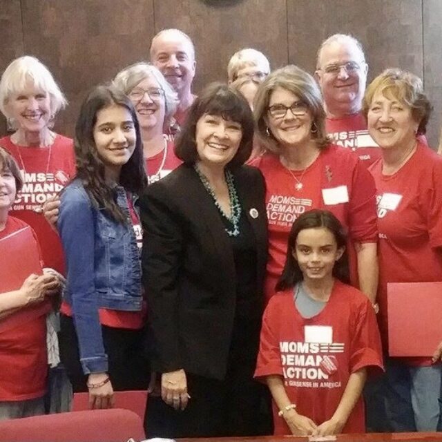 Students Demand Action volunteer Anvitha Doddipalli poses with Moms Demand Action volunteers