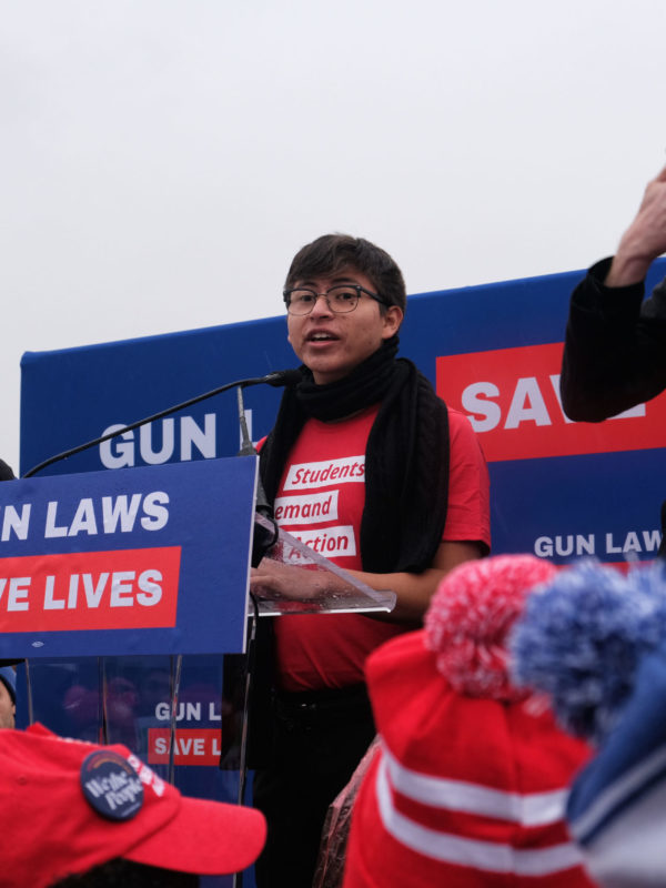 Marco speaks at the podium at the SCOTUS rally in 2019