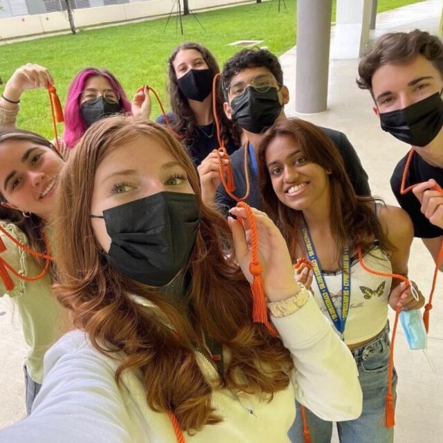 A selfie with several Cypress Bay High School Students Demand Action volunteers wearing their orange gun violence prevention honor cords